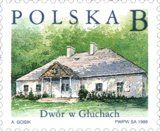 Znaczek pocztowy z 1998 roku z napisem Polska i oznaczeniem nominału - B. Przedstawia Dwór w Głuchach - dworek szlachecki na tle lasu.