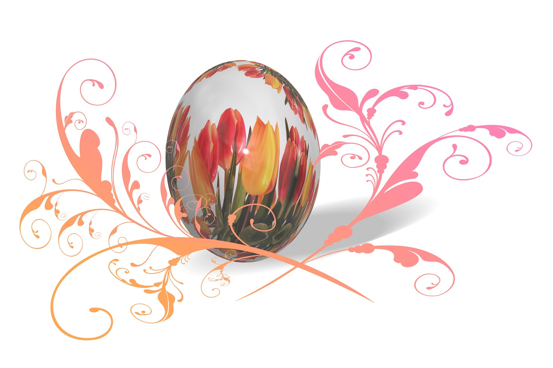 Jajko z namalowanymi kwiatami, obok pomarańczowo-różowe wzorki